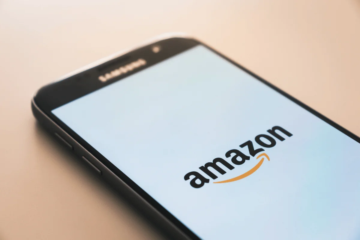 Close-up of Amazon branding on mobile device.