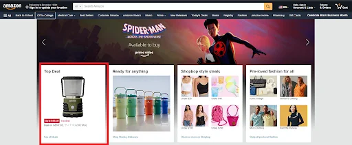 Amazon homepage featuring a top deal on a portable lantern, with a promotional banner for Spider-Man merchandise above.